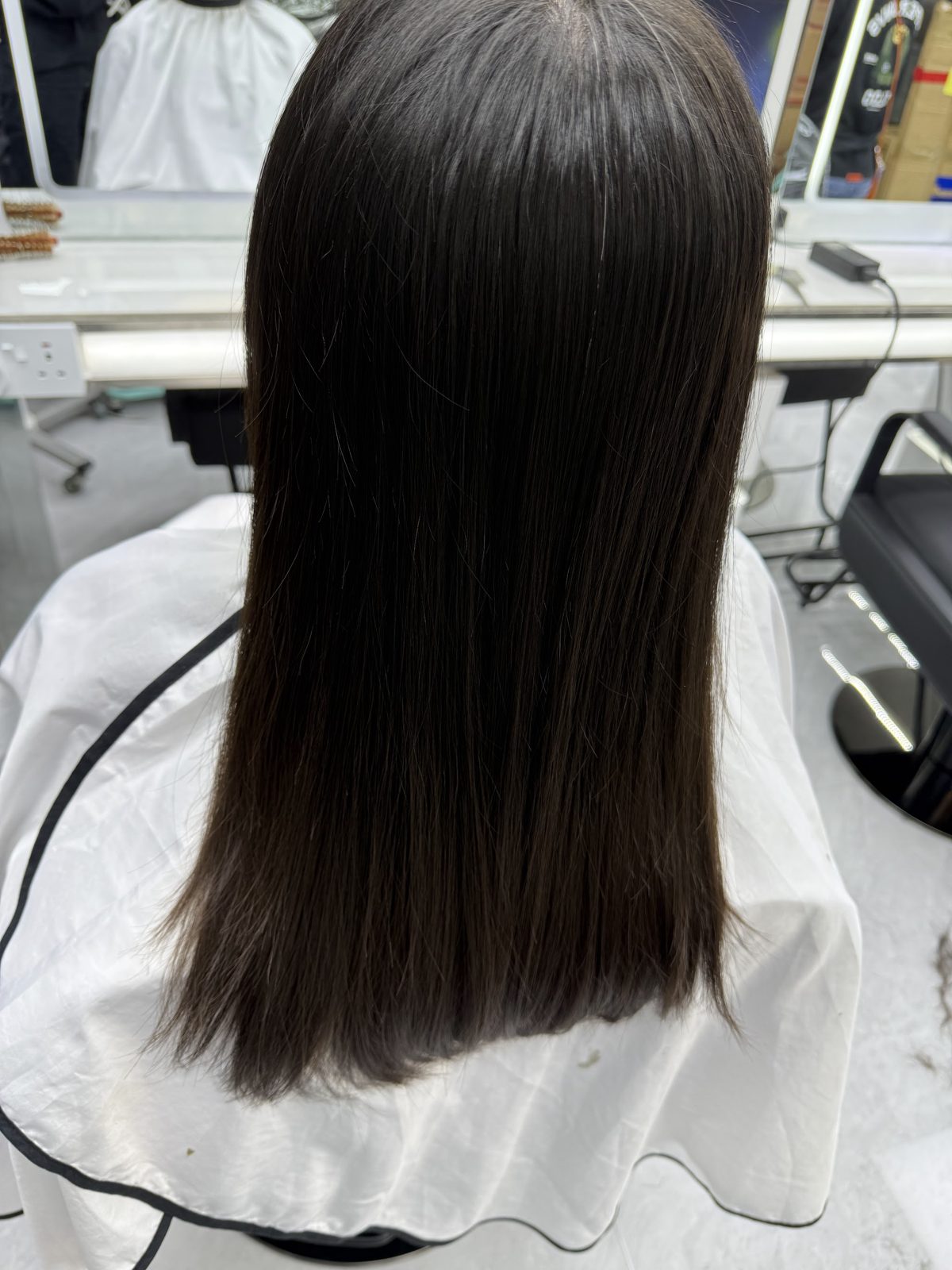 A finished dark straight cut from behind